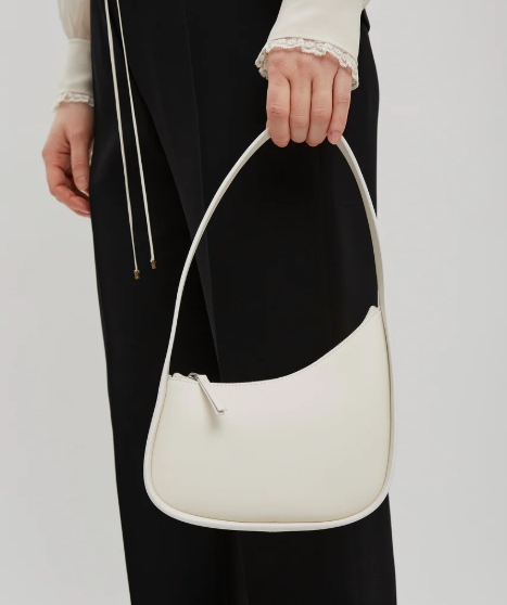 The Row Half Moon ivory leather bag
