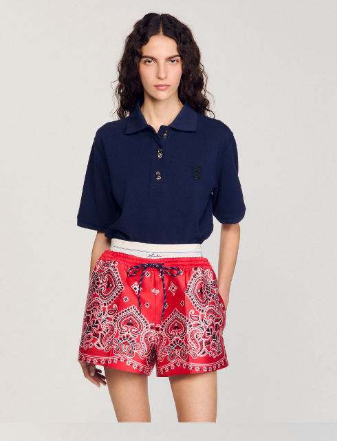 Sandro Polo shirt with decorative buttons